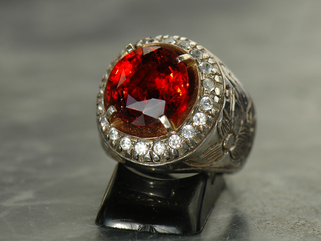 Ring made of Garnet and Silver placed for display