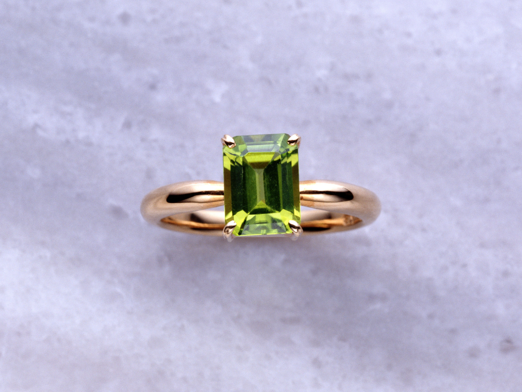 Peridot stone imbedded in a ring